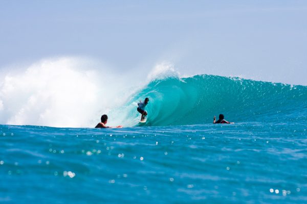 An empty line up and a couple friends enjoying perfection in Indonesia.